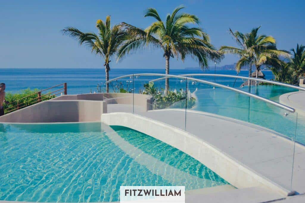 swimming pool near palm tree during daytime